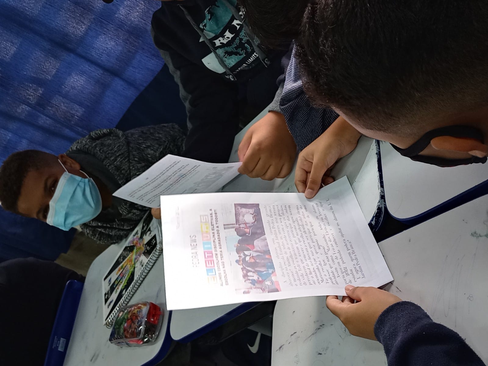 A generic square placeholder image with rounded corners in a figure.